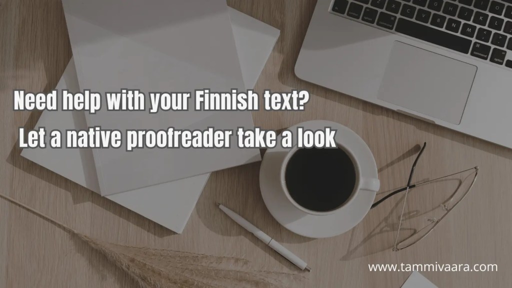 A laptop and notepad on a desk, representing professional Finnish proofreading for websites and marketing content